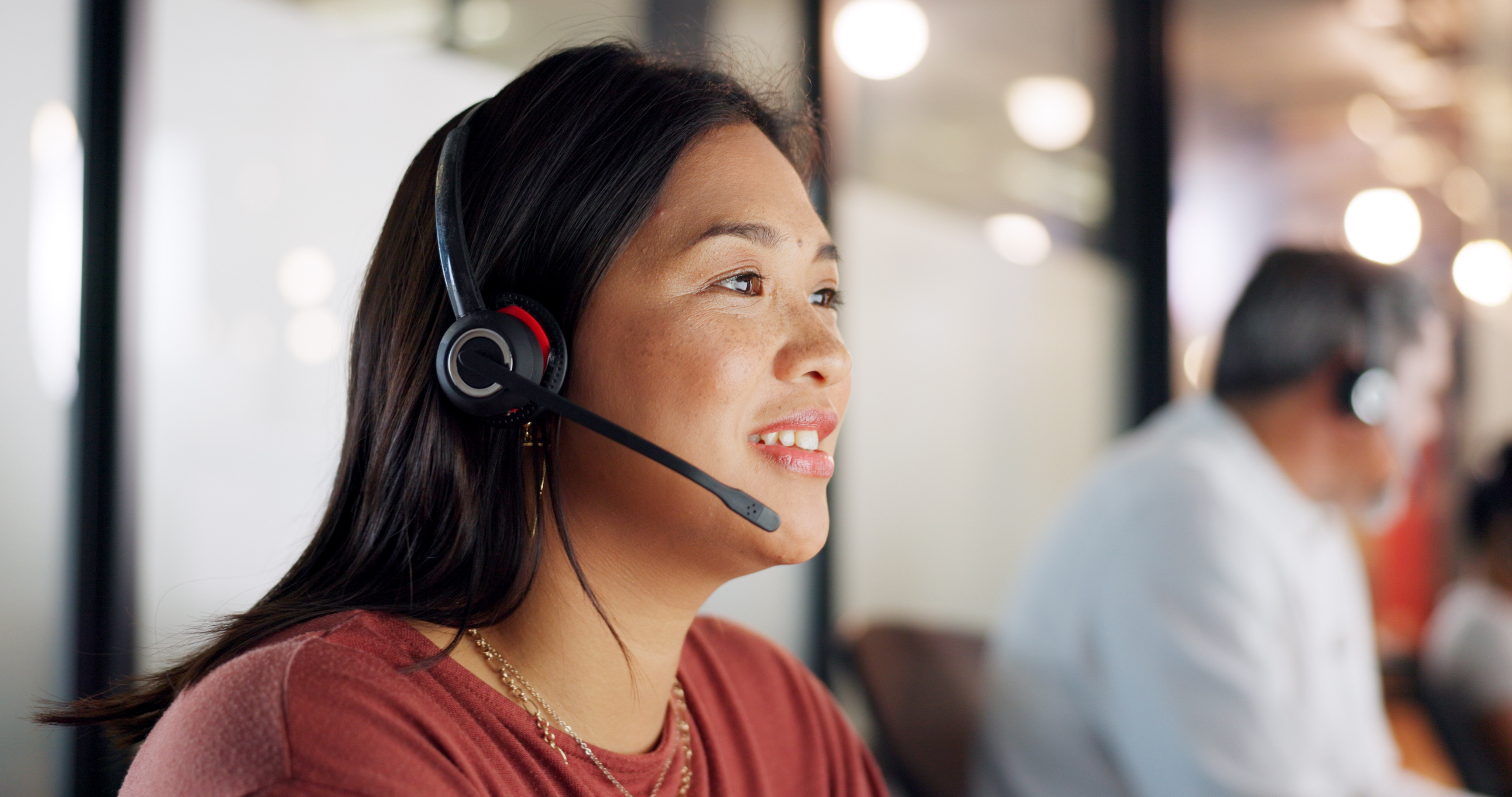 Human answering phone call on headset 