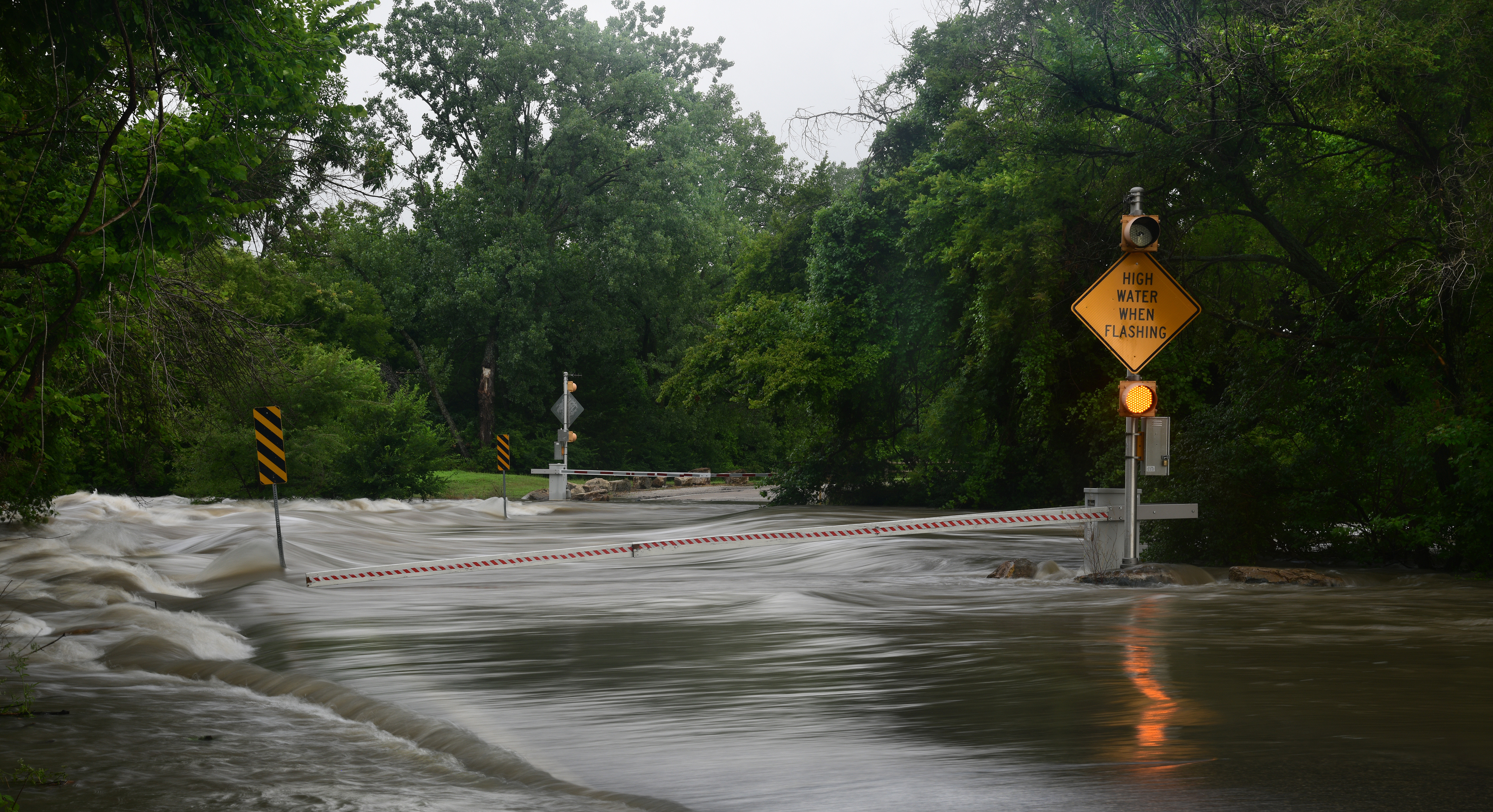 hurricane or tropical storm surge covering road with water